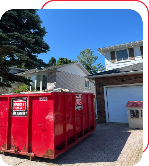 Roll-off dumpster for drywall disposal in a residential driveway in Kitchener-Waterloo.